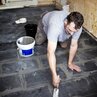 Tiler: grouting tiles with grout